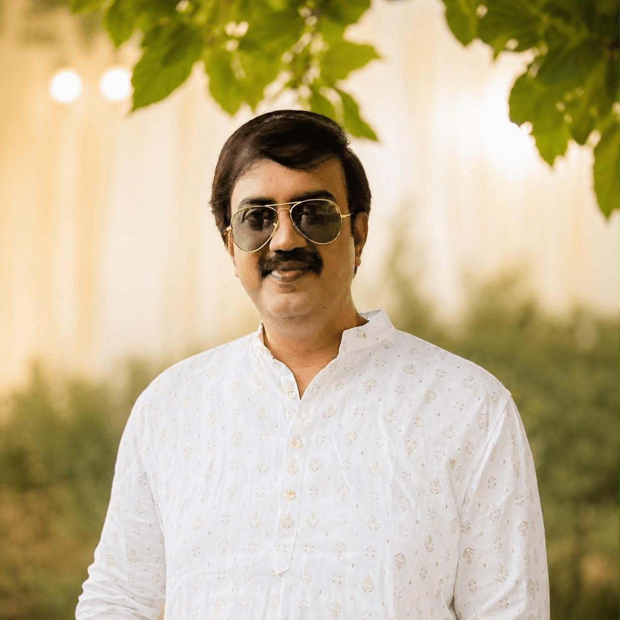 Professional portrait of B. Kamesh Babu, Founder & Director of Babu Mahal Gold Palace